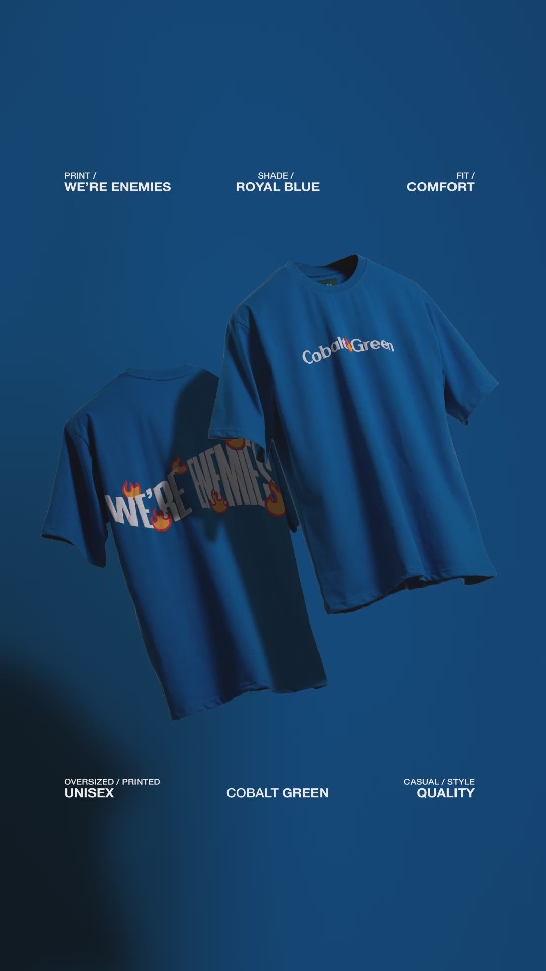 Video showcasing two oversized 'We're Enemies Tees' floating against a matching royal blue backdrop, rotating to display both the front and back of the tee. The front features 'Cobalt Green' branding, while the back highlights the bold 'We're Enemies' phrase with dynamic fire symbols in screen and puff print. The video emphasizes the oversized, unisex fit and bold, edgy design, perfect for adding attitude to any casual look.